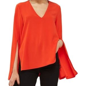 Orange top with bell sleeves